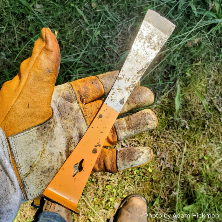 Dirty glove holding hive tool